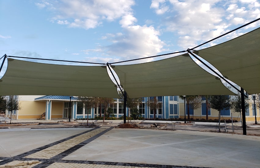 Fabric, Solid Metal or Wood Shade Structures? Here’s Why Fabric is the Best Roof Design for Carports.