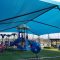 Beat the Heat: How Commercial 95 Fabric Shade Sails Protect Playgrounds and Keep Equipment Cool